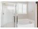 Bathroom features a large soaking tub and separate glass-enclosed shower at 2091 Hunt Woods Ct, Laughlin, NV 89029