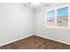 Carpeted bedroom featuring a window with shutters and a view of the neighborhood at 2091 Hunt Woods Ct, Laughlin, NV 89029