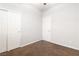 Carpeted bedroom featuring two closets and two entry doors at 2091 Hunt Woods Ct, Laughlin, NV 89029