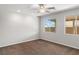 Spacious bedroom features neutral tones, carpet, ceiling fan and large windows at 2091 Hunt Woods Ct, Laughlin, NV 89029