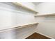 Walk-in closet with wooden shelving and carpet at 2091 Hunt Woods Ct, Laughlin, NV 89029