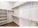 Walk-in closet features carpet flooring and shelving for optimal storage at 2091 Hunt Woods Ct, Laughlin, NV 89029