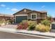 Charming single-story home featuring a well-maintained front yard and a two-car garage at 2091 Hunt Woods Ct, Laughlin, NV 89029