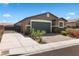 Beautiful single-story home with a two-car garage and well-maintained landscaping at 2091 Hunt Woods Ct, Laughlin, NV 89029