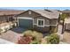 Charming single-story home featuring a well-maintained front yard and a two-car garage at 2091 Hunt Woods Ct, Laughlin, NV 89029