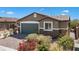 Charming single-story home featuring a well-maintained front yard and a two-car garage at 2091 Hunt Woods Ct, Laughlin, NV 89029