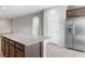Modern kitchen with center island, stainless steel appliances, and ample cabinet space at 2091 Hunt Woods Ct, Laughlin, NV 89029
