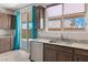 Bright kitchen with stainless steel appliances and granite countertops overlooking the backyard at 2091 Hunt Woods Ct, Laughlin, NV 89029