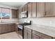 Modern kitchen showcasing stainless steel appliances and granite countertops with wood cabinets at 2091 Hunt Woods Ct, Laughlin, NV 89029