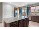 Bright kitchen boasts a center island, granite countertops, and stainless steel appliances at 2091 Hunt Woods Ct, Laughlin, NV 89029