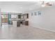 Open-concept kitchen and living area with a central island, stainless steel appliances, and tile flooring at 2091 Hunt Woods Ct, Laughlin, NV 89029