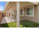 View of the covered patio area, complete with tile flooring and ample natural light at 2091 Hunt Woods Ct, Laughlin, NV 89029