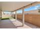 Covered patio offers sturdy support beams, ample space, and artificial grass at 2091 Hunt Woods Ct, Laughlin, NV 89029