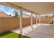 Covered patio offers shade and outdoor relaxation space with a view of the backyard at 2091 Hunt Woods Ct, Laughlin, NV 89029