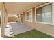 Covered patio area featuring tile flooring, providing a comfortable outdoor space near the windows at 2091 Hunt Woods Ct, Laughlin, NV 89029