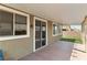 Covered patio boasts a smooth concrete surface, outdoor lighting, and artificial grass at 2091 Hunt Woods Ct, Laughlin, NV 89029