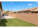 Lush side yard with a block wall, creating privacy and defining the outdoor space at 2091 Hunt Woods Ct, Laughlin, NV 89029