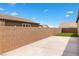 Property highlighting a block wall and lush turf, creating an inviting outdoor space at 2091 Hunt Woods Ct, Laughlin, NV 89029