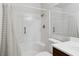 Bright bathroom featuring a white shower and tub combination with modern fixtures at 2146 High Dunes Ln, Laughlin, NV 89029