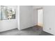 A bright bedroom with gray carpet and a window view at 2146 High Dunes Ln, Laughlin, NV 89029