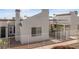 Inviting townhome with desert landscaping, a covered porch, and fully fenced yard at 2146 High Dunes Ln, Laughlin, NV 89029