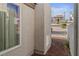 Exterior view showing neutral stucco and a window with desert landscaping in the background at 2146 High Dunes Ln, Laughlin, NV 89029