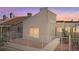 Exterior of townhome with desert landscaping and white picket fence at 2146 High Dunes Ln, Laughlin, NV 89029