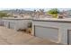 Elevated exterior view of Las Vegas townhouses with attached garages and desert landscaping at 2146 High Dunes Ln, Laughlin, NV 89029