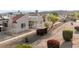 Exterior view showcasing desert landscaping, mature trees, and attractive grounds at 2146 High Dunes Ln, Laughlin, NV 89029