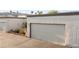 Attached one-car garage with desert landscaping in a Las Vegas neighborhood with palm trees at 2146 High Dunes Ln, Laughlin, NV 89029