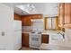 Functional kitchen with white appliances, oak cabinets, and ample counter space at 2146 High Dunes Ln, Laughlin, NV 89029