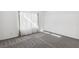 Bright, airy living room with carpet floors, natural light, and neutral decor at 2146 High Dunes Ln, Laughlin, NV 89029