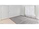 Bright, airy living room featuring carpet and tile flooring and white walls at 2146 High Dunes Ln, Laughlin, NV 89029