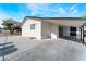 A cozy backyard with a covered patio and xeriscaping for easy maintenance at 2716 Saber Dr, North Las Vegas, NV 89032