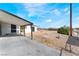 The large backyard has a large concrete patio and gravel landscaping at 2716 Saber Dr, North Las Vegas, NV 89032