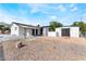 Large backyard features desert-friendly landscape and storage shed at 2716 Saber Dr, North Las Vegas, NV 89032
