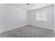 Bedroom with neutral carpet and a window providing natural light at 2716 Saber Dr, North Las Vegas, NV 89032