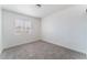 Bedroom features neutral carpet and a window providing natural light at 2716 Saber Dr, North Las Vegas, NV 89032