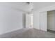 Bedroom features neutral carpet, a closet with sliding doors, and a door to a connecting room at 2716 Saber Dr, North Las Vegas, NV 89032