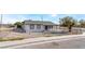 Charming single-story home with desert landscaping and a freshly painted exterior at 2716 Saber Dr, North Las Vegas, NV 89032