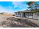 Curb view of a charming single-story home with desert landscaping at 2716 Saber Dr, North Las Vegas, NV 89032