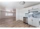 Open floor plan with kitchen featuring stainless steel appliances, and an adjoining living space at 2716 Saber Dr, North Las Vegas, NV 89032
