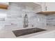Close-up of the kitchen sink, backsplash and countertop at 2716 Saber Dr, North Las Vegas, NV 89032