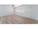 Bright living room featuring a window, light wood floors and a front door at 2716 Saber Dr, North Las Vegas, NV 89032