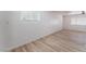 Bright living room features wood-look flooring, and a window with lots of natural light at 2716 Saber Dr, North Las Vegas, NV 89032
