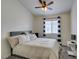 Cozy bedroom with neutral color palette, ceiling fan, and a large comfortable bed at 2787 Fountain Ridge Ln, Henderson, NV 89074