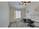 Bright bedroom with neutral walls and ceiling fan, desks and carpeted floors at 2787 Fountain Ridge Ln, Henderson, NV 89074