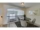 Charming dining area with modern black table set, connecting to a naturally lit living room at 2787 Fountain Ridge Ln, Henderson, NV 89074