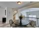 Stylish dining room view, connecting seamlessly with the staircase and bright, airy living area at 2787 Fountain Ridge Ln, Henderson, NV 89074