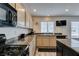 Bright kitchen with granite countertops, stainless appliances, and modern lighting at 2787 Fountain Ridge Ln, Henderson, NV 89074